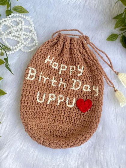 I love when customers have creative ideas. This is a personalized drawstring pouch I made to hold a birthday gift, embroidered with a special message.