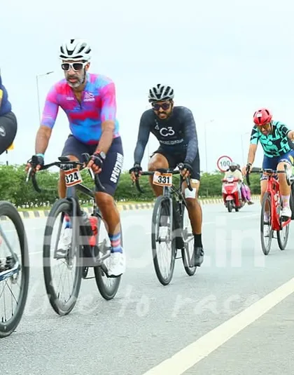 A diverse group of riders, each with their own unique kit and bike, competes together. This highlights the inclusive nature of our racing community.