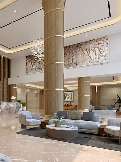 Another view of the lobby at Voraskyline Icon. The double-height space is anchored by a large, sculptural column and features bas-relief art panels, adding a layer of cultural texture to the modern design.