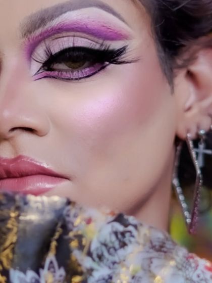 A close-up on the expertly blended eyeshadow and sharp, winged liner, key skills in drag makeup.
