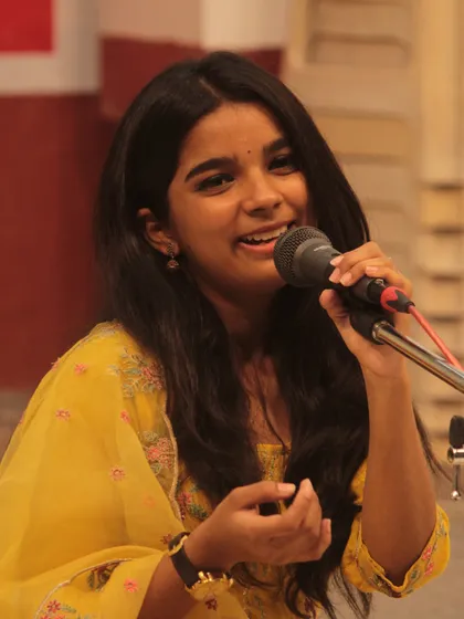 The joy of singing is evident on this young student's face during her performance at the 'Swarveni Aradhana'. We nurture talent from a very young age.
