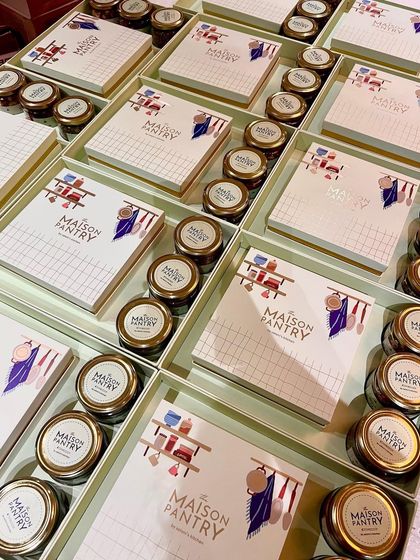 A view of my elegant gift trays ready for dispatch. Each tray is thoughtfully packed with items like Honey & Paprika Almonds, Herbed Pumpkin Seeds, and a box of Masala Gur.