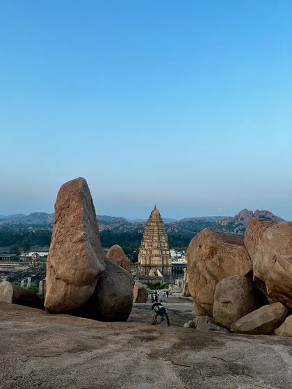 The Virupaksha Temple in Hampi, viewed from atop Hemakuta Hill. The giant boulders and sacred architecture of this land have witnessed sages and yogis practicing tapasya (austerities) for millennia.