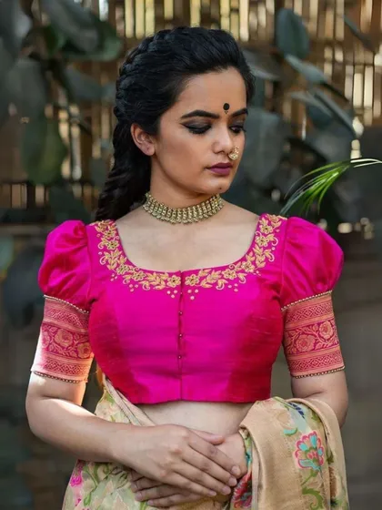 A closer look at the craftsmanship of my custom-fit blouses. This piece features intricate hand-embroidery around the neckline and puffed sleeves with a traditional woven border, designed to provide a perfect fit for curvy women.