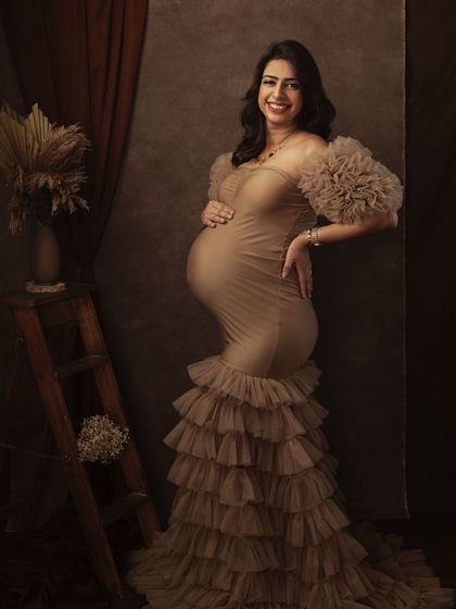 Leaning against a rustic ladder, this pose adds a different dimension and a touch of vintage charm to the fine art session.