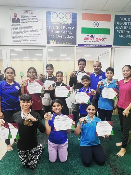 Our team of medal winners from the Tumkur competition, proudly displaying their certificates and medals with their coach.