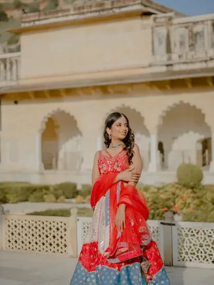 A solo portrait of the bride, looking radiant and confident in the palace courtyard. Capturing these individual moments is just as important as the couple shots in telling your complete story.