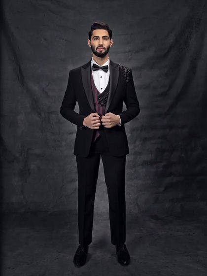 Beautifully curated kut dana work on this black suit adds a touch of sparkle and makes it the right fit for this wedding season.