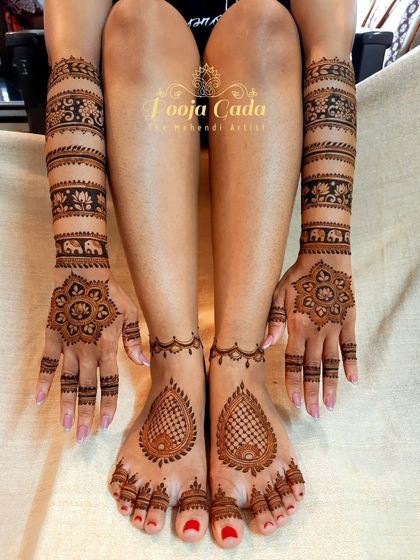 A complete bridal look, showing how hand and feet designs can be coordinated. The feet feature a simple yet elegant paisley design with a delicate ankle band, perfectly matching the unique banded arm design.