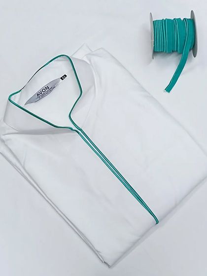 A crisp white saya kurta is given a pop of color with this turquoise piping. You can choose from many colors to customize your look.