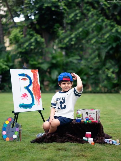 A cool pose with a backward cap. I make sure to capture a variety of shots, from candid action to posed portraits, to showcase your child's personality.