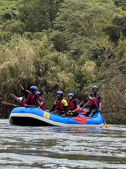 Participants enjoying the ride on the Barapole river. This image captures the excitement and beautiful scenery of our Coorg rafting course.