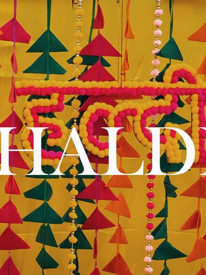 A detail shot of the colorful haldi decor, setting the vibrant and festive mood for the event.