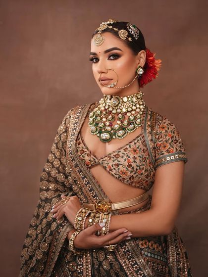 A full view of this bride's opulent look, combining traditional elements with modern makeup artistry.