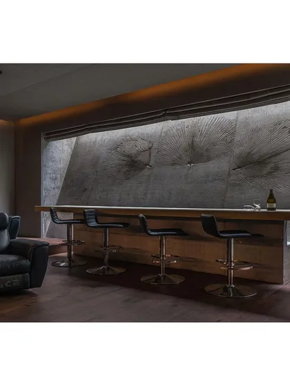 We experiment with materials to leave lasting impressions. Here, we used real leaves to imprint textures onto a concrete wall, creating a fossil-like effect that brings an artistic, natural element to this home bar.