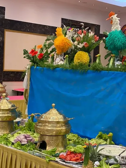 Our buffet presentation is about more than just food; it's about creating a visual feast. Here, we've used intricate vegetable carvings to add a touch of artistry to the salad bar at a wedding reception.
