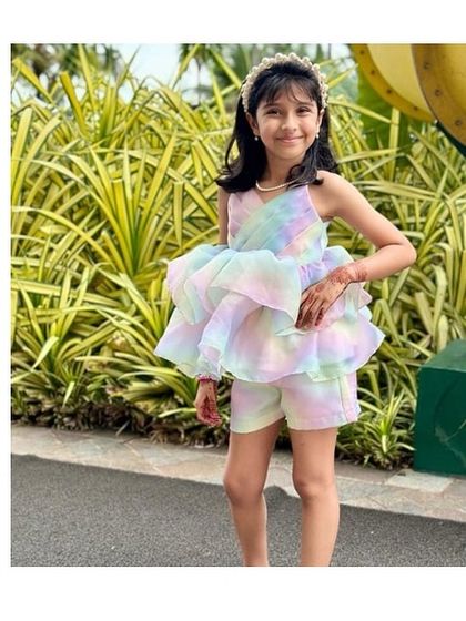 Our favorite little girl looking absolutely lovely in the Rainbow Co-ord set. It's the perfect outfit for an outdoor party, combining high style with the comfort to run and play.