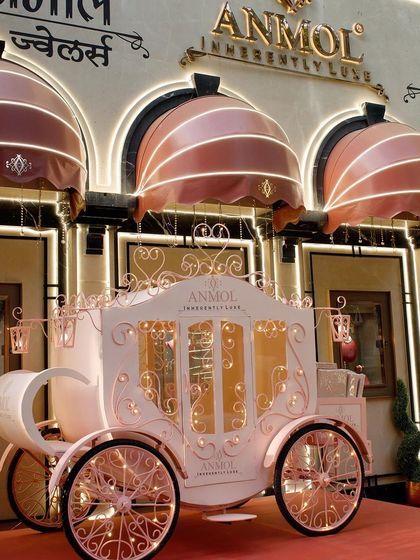 An enchanting fairytale carriage, custom-built for a special event at Anmol Jewellers, creating a magical and luxurious photo opportunity.