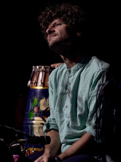 A dramatic shot of Michael League, bathed in light, during our concert in Delhi. His focus and passion are palpable in this image.