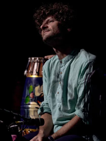 A dramatic shot of Michael League, bathed in light, during our concert in Delhi. His focus and passion are palpable in this image.