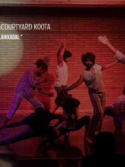 A dynamic group performance of 'Alaikkadal', a devised folk contemporary exploration from the depths of the sea. The dancers' movements evoke the power and fluidity of the ocean.