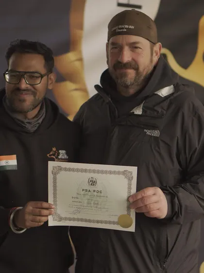 Results speak louder than words. Here I am receiving the PSA PDC certificate for my dog Angel, a testament to her hard work and the effectiveness of my training methods. I don't just train dogs, I produce certified, titled athletes.