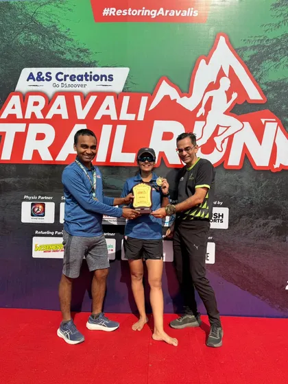 A winner receiving her trophy on stage. We ensure every winner gets their moment of recognition.