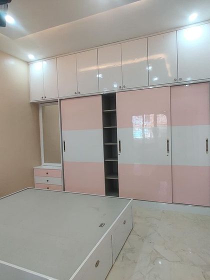 A stylish pink and white sliding wardrobe in a newly completed bedroom. This was part of one of our biggest residential projects, and we are thrilled with the outcome.