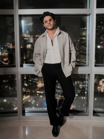 Another shot against the stunning Dubai skyline. The simple, elegant outfit allows the focus to remain on Dulquer.