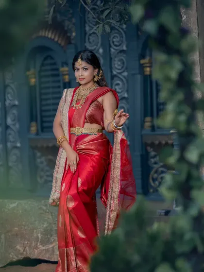This student's portfolio shot captures a timeless and elegant bridal pose, showcasing the full effect of the makeup, hair, and saree.