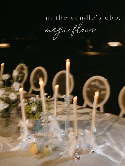 A motion-blurred shot of the candlelit tablescape, capturing the magical and dreamlike quality of the evening.