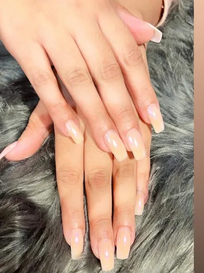 A simple and elegant set of natural-looking nude extensions in a classic square shape, perfect for a professional and polished look.