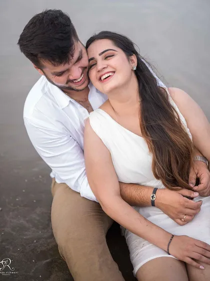 Even on an overcast, rainy day in Goa, the laughter doesn't stop. This cozy, happy moment from a beach session shows that beautiful photos aren't about perfect weather, but about the warmth and connection you share.
