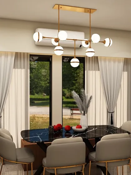 The dining area of the same project, featuring a modern chandelier over a black marble-top table, with large windows providing a beautiful view and ample daylight.