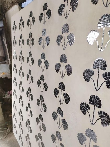 The finished Thikri panel, with hundreds of hand-cut pieces of convex glass set into plaster. This 400-year-old Rajasthani craft creates a stunning, reflective surface that plays with light.
