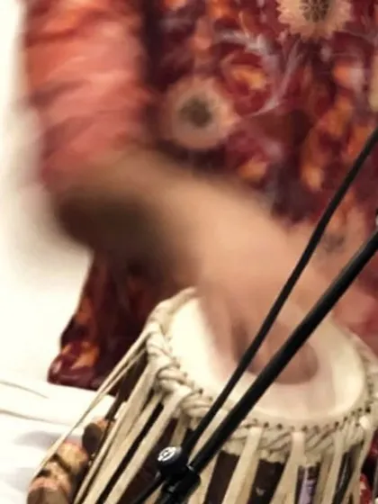 A motion-blur photo capturing the speed and energy of my hands during a fast-paced section of a performance. This shows the physical intensity required for complex classical pieces.