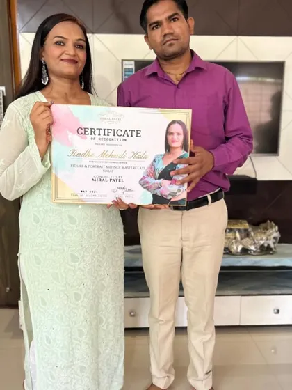 Receiving a certificate for a Radhe Krishna and portrait mehndi masterclass. I am always learning new techniques to bring the best to my clients.