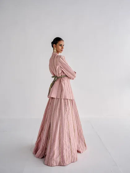A full-length back view of the same pink suit, showing how I used a contrasting belt to cinch the waist and add another layer of detail to the styling.