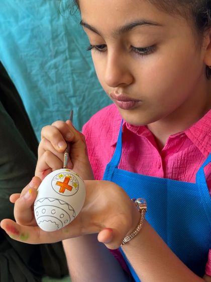 A close-up of some detailed Easter egg painting. Even the older kids get completely absorbed in decorating their own unique designs.