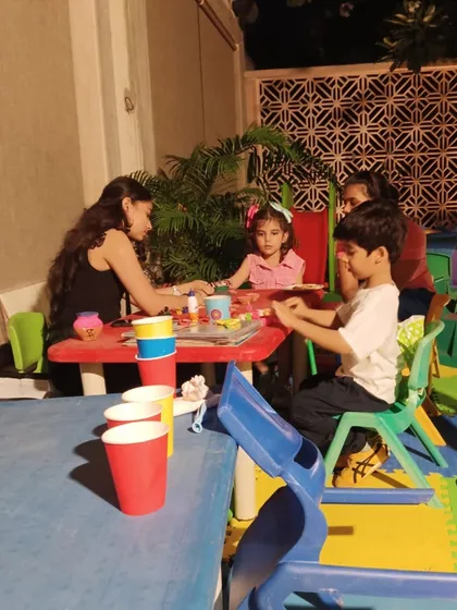 Another view of the kids' art and craft activity table, fully stocked with supplies for an evening of creative fun.