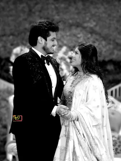 A timeless black and white portrait of the couple sharing a quiet moment during their Roka. This photo strips away the color to focus purely on their expressions and connection.