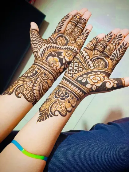 A classic traditional mehandi design with a mix of floral, paisley, and geometric elements.