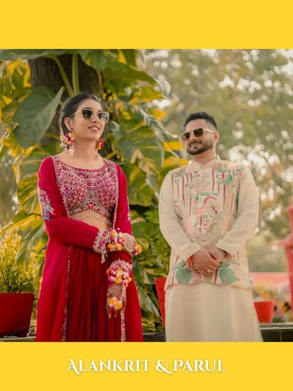 A classic portrait of the couple at their outdoor Haldi ceremony. The vibrant yellow border and their stylish poses make for a picture-perfect memory.