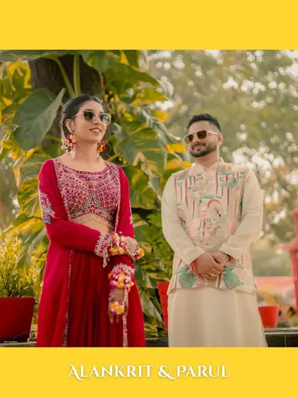 A classic portrait of the couple standing together, their stylish sunglasses and relaxed poses perfectly capturing the cool, daytime vibe of their Haldi.