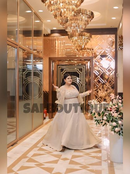 Feeling like a princess in this ethereal off-white gown with a matching cape. The subtle shimmer and flowy fabric make it a dream outfit for a special occasion.