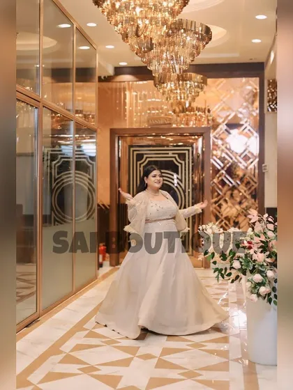Feeling like a princess in this ethereal off-white gown with a matching cape. The subtle shimmer and flowy fabric make it a dream outfit for a special occasion.
