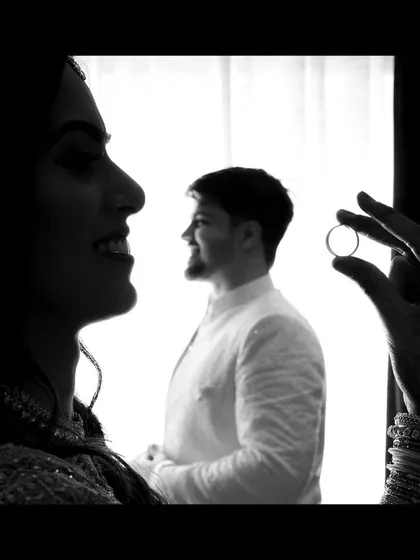 We love finding creative ways to tell your story. This artistic silhouette shot uses the engagement ring to frame the groom, symbolizing the promise and future that awaits the couple.
