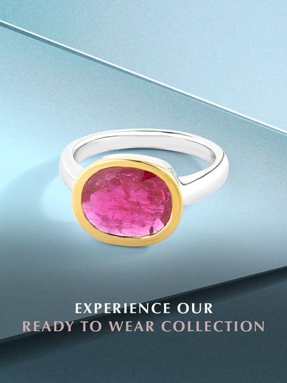 Experience my ready-to-wear collection. This piece features a striking oval-cut ruby in a flawless gold bezel setting on a sterling silver band. It is a modern, refined piece for your collection.
