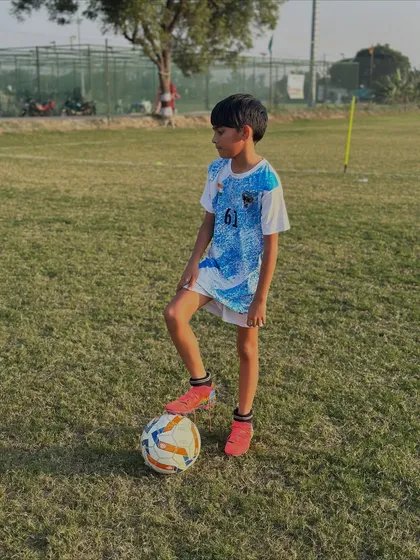 Another future star with his foot on the ball. This image captures the pride and determination we instill in our players.