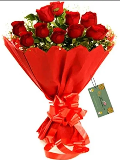 A dozen red roses wrapped in bold red paper with a matching bow. This is a timeless gift that clearly expresses love and admiration.